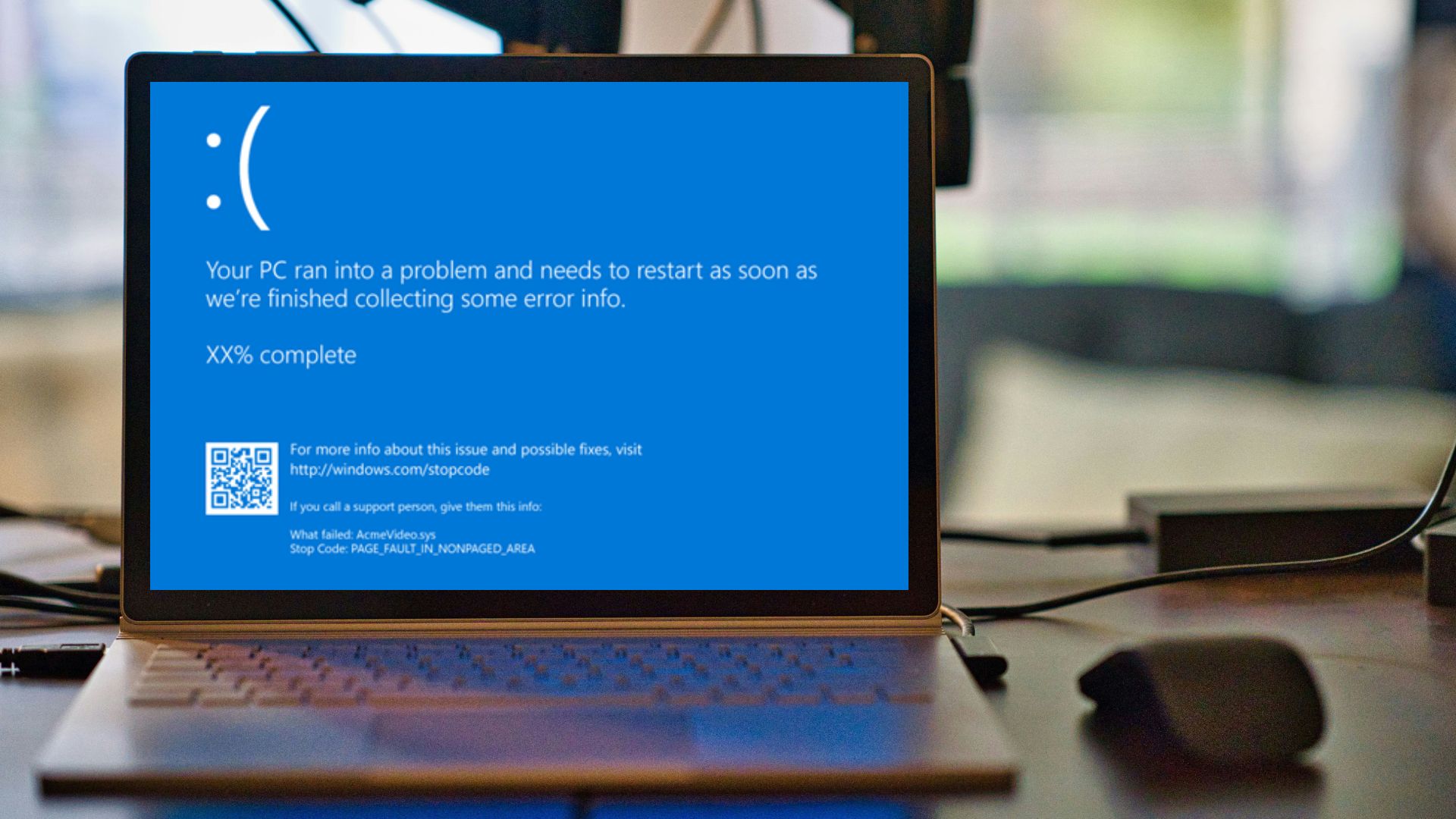 Laptop displaying Blue Screen of Death (BSOD) error due to faulty CrowdStrike update, causing a global Microsoft outage and widespread IT disruptions.